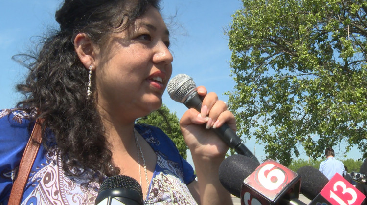 Erika Fierro speaks to media after returning from her immigration check-in. She was concerned Thursday's check-in would end in her immediate deportation. - Lauren Chapman/IPB News