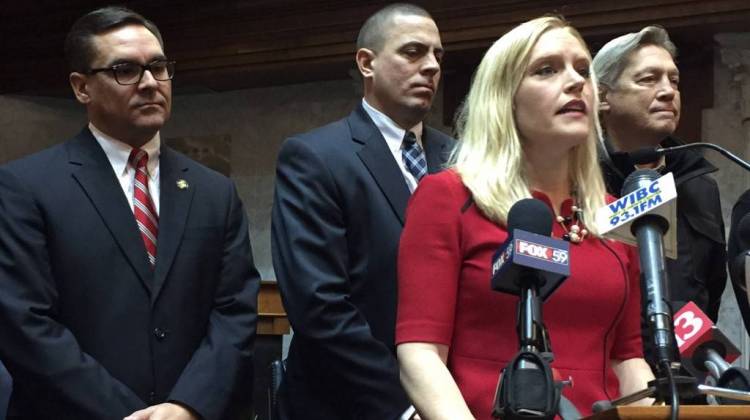 Sen. Erin Houchin (R-Salem) is surrounded by Indiana prosecutors when she announces in 2016 she'll author the felony arrestee DNA bill. - Brandon Smith/IPB News