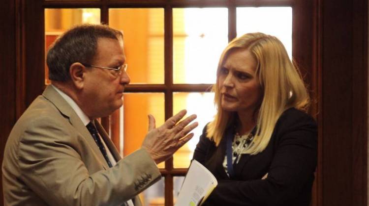 In this file photo, Sen. Erin Houchin (R-Salem), right, speaks to fellow Sen. Mike Young (R-Indianapolis) on the Senate floor.  - Lauren Chapman/IPB News, File