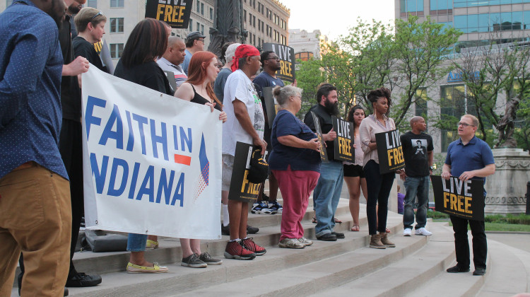 Christ Church Cathedral Dean Stephen Carlsen speaks to the crowd of activists on Monument Circle. - Lauren Chapman/IPB News