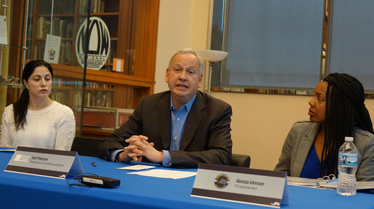 Christel House International CEO Bart Peterson, center, talks at the Indianapolis Public Schools press conference Saturday, Jan. 11, 2020 at Central Library, as IPS Superintendent Aleesia Johnson, right, and Phalen Leadership Academy regional director Nicola Fama, left, listen. - Eric Weddle/WFYI News