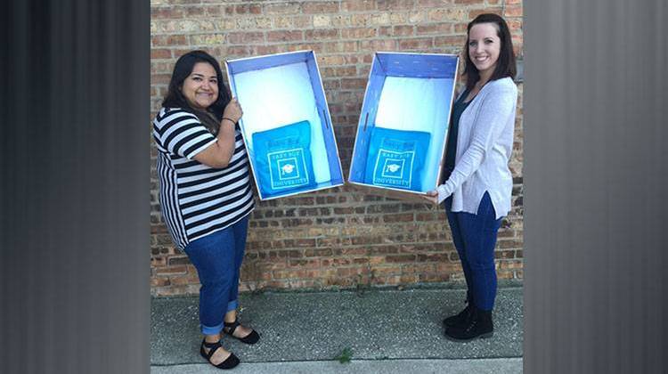 South Bend Family and Children's Center staff hold new baby boxes. The new program aims to reduce infant mortality rates in St. Joseph County.  - Courtesy Family & Children's Center, South Bend