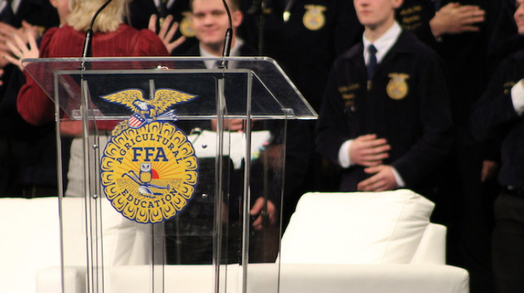 Members of the National FFA Choir sing a medley of state anthems at the organization's opening luncheon. - Erica Irish/WFYI