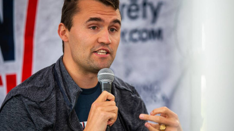 Officials say a suspect in the fatal shooting of conservative activist Charlie Kirk, pictured in March, was taken into custody on Thursday night. - Benjamin Hanson / Getty Images