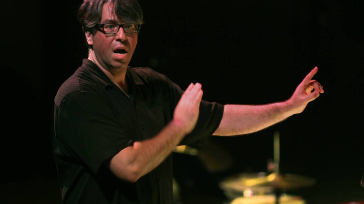 Julian Wachner conducts the choir of Trinity Wall Street and the Bang on a Can All-Stars at Lincoln Center in New York in 2014. Wachner, who was dismissed from his position at Trinity in 2022, has been charged with possession of child sex abuse material in Indiana. - Carolyn Cole / Getty Images