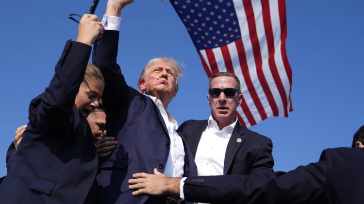 Former President Donald Trump is rushed offstage during a rally in Butler, Pa., after an assassination attempt on his life. - Evan Vucci / AP