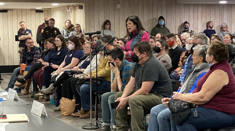 The Floyd County Library has drawn criticism and support after staff recently read an LGBTQ book during a children's story time. Pictured, a woman speaks against the library's decision during a board of trustees meeting Monday at the main branch in New Albany. Of the more than 100 people in attendance, the majority were in support of the book.  - Aprile Rickert/Louisville Public Media