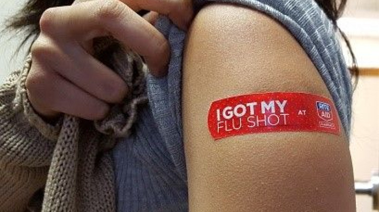 A woman shows her flu shot after receiving vaccine at a local drug store, taken Nov. 2015.  - Whoisjohngalt, Wikimedia Commons