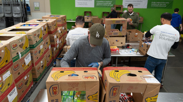 Volunteers pack items for distribution at the Oregon Food Bank in Portland, Ore., on Wednesday, Oct. 29, 2025. - AP Photo/Jenny Kane