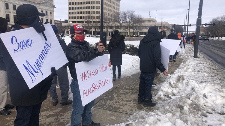 Protesters stand at the intersection of South Clinton and Berry Streets holding signs in support of Myanmar's civilian leader, Aung San Suu Kyi, on Wednesday February 3, 2021. - Ella Abbott/WBOI