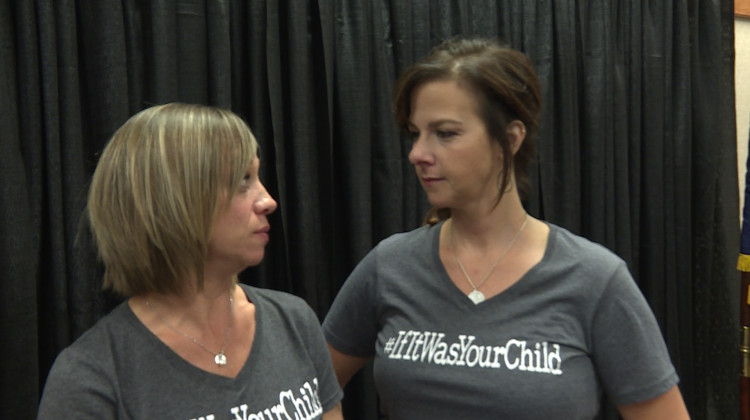 Stacie Davidson (left) and Kari Rhineheart (right) wearing tee shirts with the name of the nonprofit they started to get answers about why so many kids in Franklin are getting cancer. - Rebecca Thiele/IPB News