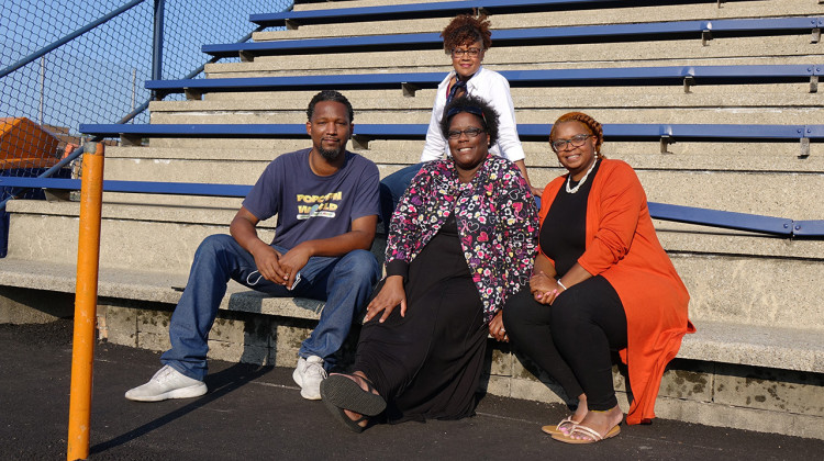 These parents believe that new funding could be a turning point for Gary Community Schools. From top left to bottom right: Kimberly Kimble, LeBarron Burton, Nina Burton, and Krystal Swain on the bleachers at West Side Leadership Academy on Sept. 10. - (Dylan Peers McCoy/WFYI)