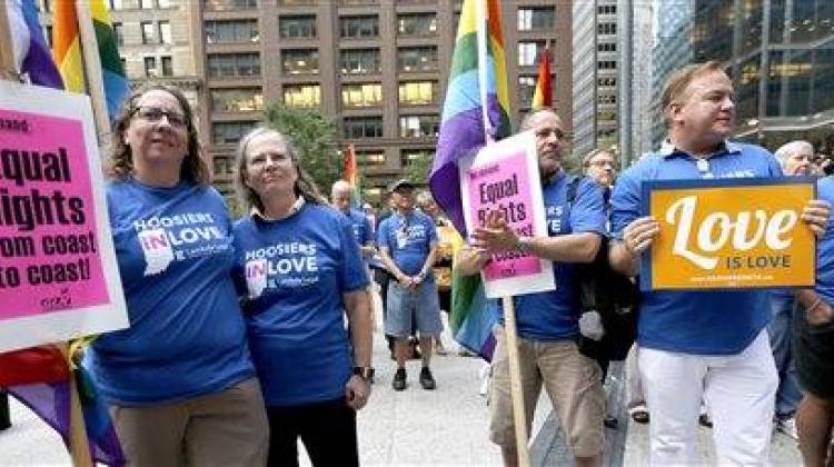Supporters of gay marriage in Wisconsin and Indiana attend a rally at the federal plaza Monday, Aug. 25, 2014, in Chicago. The Chicago-based 7th U.S. Circuit Court of Appeals will hear arguments Tuesday on gay marriage fights from Indiana and Wisconsin, setting the stage for one ruling. Each case deals with whether statewide gay marriage bans violate the Constitution. (AP Photo/Charles Rex Arbogast)
