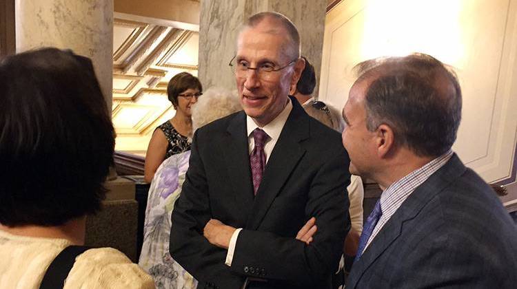 Indiana Supreme Court Justice Geoffrey Slaughter speaks with friends after the ceremony. - Brandon Smith/IPBS