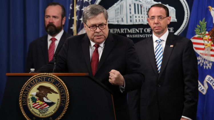 Attorney General William Barr speaks about the release of the redacted version of the Mueller report as U.S. Deputy Attorney General Rod Rosenstein, right, and U.S. Acting Principal Associate Deputy Attorney General Ed O'Callaghan listen at the Department of Justice Thursday in Washington, D.C.  - Win McNamee/Getty Images