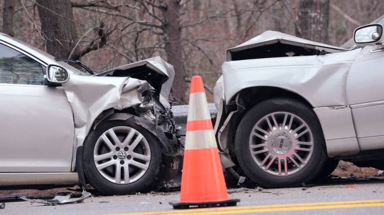 Officials investigate the scene of a fatal head-on collision on Route 1 at the town line of Wiscasset and Woolwich in Maine in May.