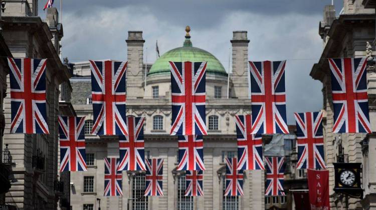 Union flags fly as banners across a street in central London on Tuesday. EU leaders attempted to rescue the European project and Prime Minister David Cameron sought to calm fears over the U.K.'s vote to leave the bloc as ratings agencies downgraded the country.