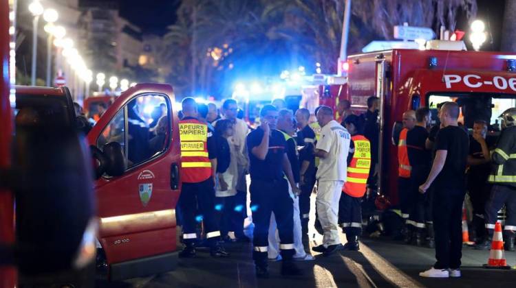 Police officers, firefighters and rescue workers at the Promenade des Anglais in Nice after a truck drove into a crowd watching a fireworks display in the French Riviera resort.