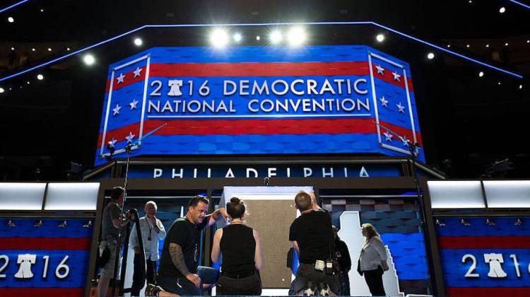 Workers prepare the podium Sunday ahead of the Democratic National Convention at the Wells Fargo Center in Philadelphia.