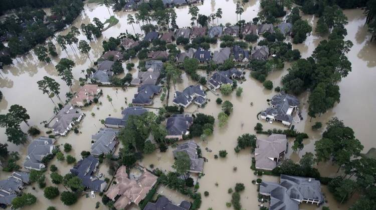 Homes near Lake Houston were almost completely under water on Wednesday. Based on the experiences of past storm victims, returning home could take years. - Win McNamee/Getty Images