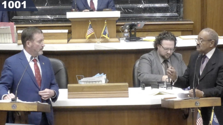 Reps. Chuck Goodrich (R-Noblesville) and Vernon Smith (D-Gary) discuss HB 1001 during the bill’s third reading on Tuesday. - Screenshot iga.in.gov