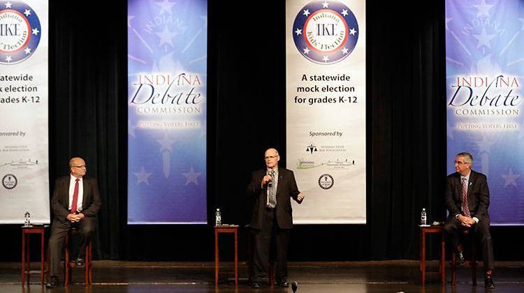 Democrat John Gregg, Libetarian Rex Bell and Republican Eric Holcomb took the stage at Lawrence North High School for the first of three scheduled gubernatorial debates. - AP Photo/Darron Cummings, Pool