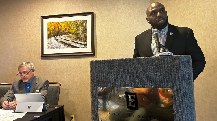 Carlos Perkins, senior pastor of Bethel Cathedral African Methodist Episcopal Church, explains why he is against Valor Classical Academy receiving a charter to open in Pike Township as Tim Ziebarth, a Grace College executive dean listens. Perkins spoke at a public hearing about the proposed school held by charter authorizer Grace College on Monday, April 10, 2023 at the Embassy Suites in northwest Indianapolis. - Eric Weddle / WFYI