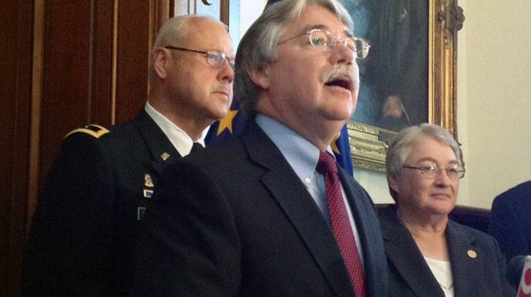 Indiana Attorney General Greg Zoeller (front) wants to enhance consumer protection measures for active-duty military service members.   - Brandon Smith