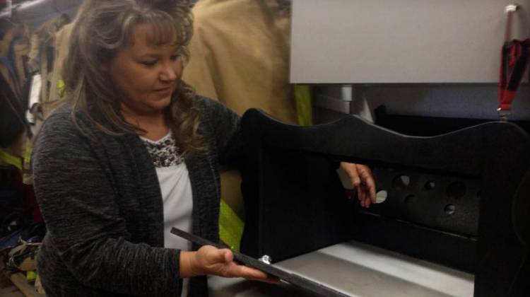 Monica Kelsey opens the baby box prototype in this 2015 file photo. - Gretchen Frazee/IPB