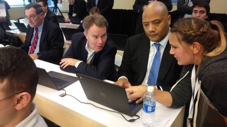 U.S. Rep. Andre Carson (D-Ind.) and Indianapolis Mayor Joe Hogsett receive help during a coding class. - (Lauren Chapman/IPB News)