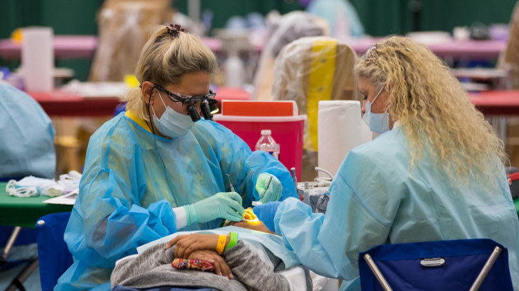 Pathway to Health volunteers provide dental care to a patient at a free clinic in Fort Worth, Texas in September 2018. - (Alden J. Ho/courtesy photo)