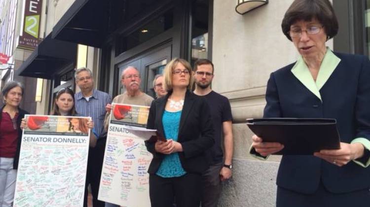 Dr. Indra Frank stands outside of Senator Joe Donnelly's Indianapolis office in support of Clean Power legislation.