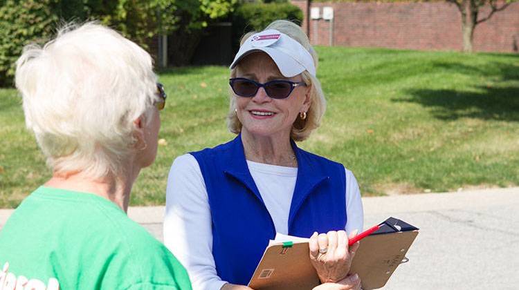 Democrat Pam Hickman talks with a voter while campaigning in a northeastside neighborhood. - Doug Jaggers
