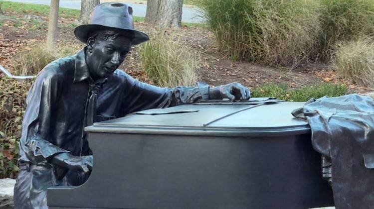 A statue of Hoagy Carmichael seated at a piano is on the Indiana University Bloomington campus near the IU Cinema. - Zach Herndon/WFIU