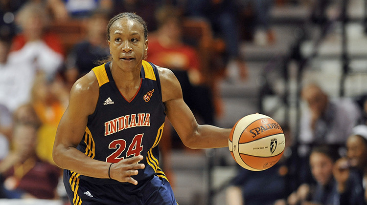 Indiana Fever's Tamika Catchings runs up court in Game 3 of the WNBA basketball Eastern Conference finals against the Connecticut Sun on Oct. 11, 2012. - AP Photo/Jessica Hill