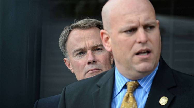 Democratic candidate for Indianapolis mayor Joe Hogsett, left, looks on at Rick Snyder, president of the Indianapolis police union, during a press conference Thursday. - Ryan Delaney/WFYI