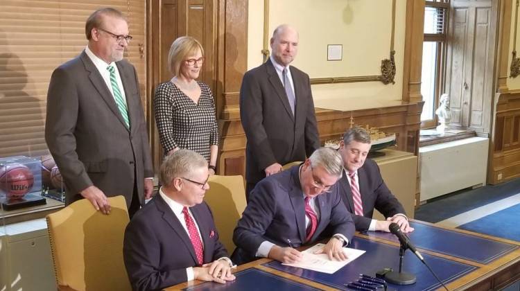 Gov. Eric Holcomb signs Sunday alcohol sales into law, the first time in Indiana state history.  - Samantha Horton/IPB News