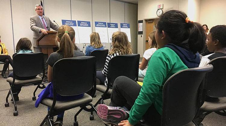 Students from West Lafayette's Cumberland and Happy Hollow Elementary Schools listen to Gov. Eric Holcomb lay out his priorities for 2018, which include taking up their cause of naming Say's Firefly Indiana's official state insect. - Stan Jastrzebski/WBAA News