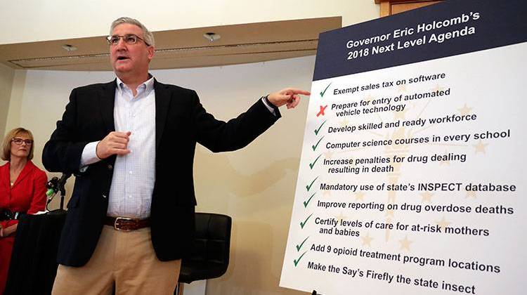 Indiana Gov. Eric Holcomb outlines his goals for a special session of the legislature during a press conference in Indianapolis, Monday, March 19, 2018.  - AP Photo/Michael Conroy