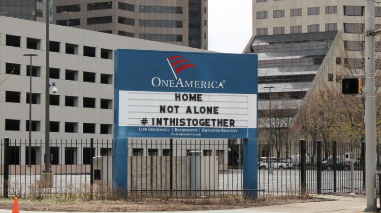 One America's signs in downtown Indianapolis usually display a pun. Since the governor's initial "Stay-At-Home" order, both have encouraged social distancing. It reads: "Home, not alone. #InThisTogether." - Lauren Chapman/IPB News