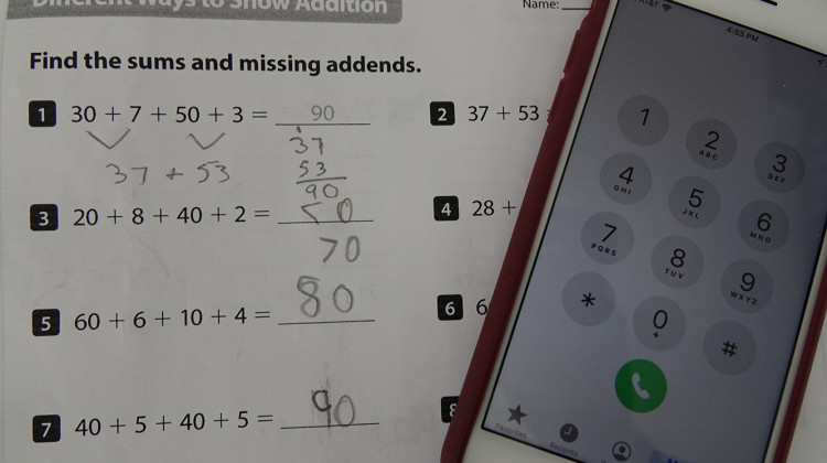 A second grade math worksheet and phone. - WFYI News