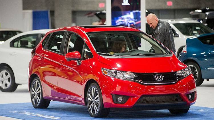 People look over a 2015 Honda Fit vehicle on display at the Washington Auto Show, Friday, Jan. 30, 2015, in Washington. -  AP Photo/Pablo Martinez Monsivais