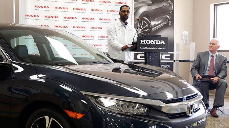 Fred Payne (left), business division manager at Honda Manufacturing of Indiana, provides details about the new investment and job creation taking place at the Greensburg plant as Indiana Gov. Mike Pence looks on. - Photo courtesy Honda