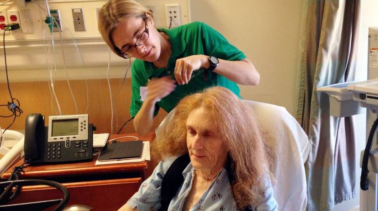 Volunteer Julia Torrano helps Estelle Day, 79, style her hair while she's a patient at UCLA Medical Center.