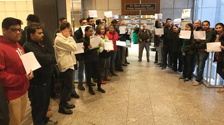 More than a dozen people protested at the meeting where the city-County Council voted 25-0 in an ordinance that would identify high-crime hotels. - Drew Daudelin/WFYI