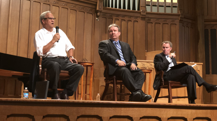 Republican State Sen. Jim Merritt, Libertarian Douglas McNaughton and incumbent Democratic Mayor Joe Hogsett participated in a public forum on the city's neighborhoods. - Darian Benson/WFYI