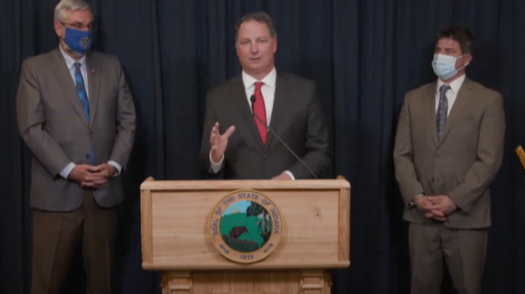 Speaker Todd Huston (R-Fishers) discusses education funding in the new state budget, flanked by Gov. Eric Holcomb, left, and Senate President Pro Tem Rodric Bray (R-Martinsville), right.  - Screenshot from YouTube