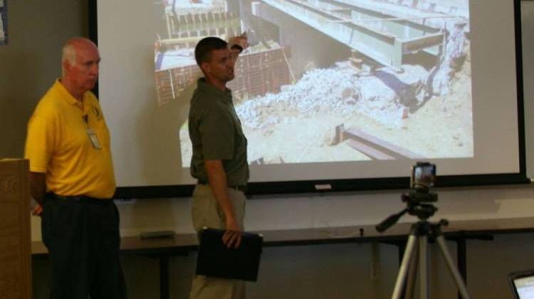 Jeremy Hunter, a bridge designer for the Indiana Department of Transportation, points to the pier that failed on I-65 during a briefing in West Lafayette Monday, Aug. 10, 2015 - Photo by Charlotte Tuggle, WBAA News