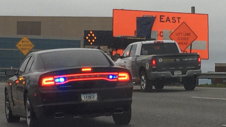 Workers uncover signs along Interstate 70 Monday morning. - Indiana Department of Transportation