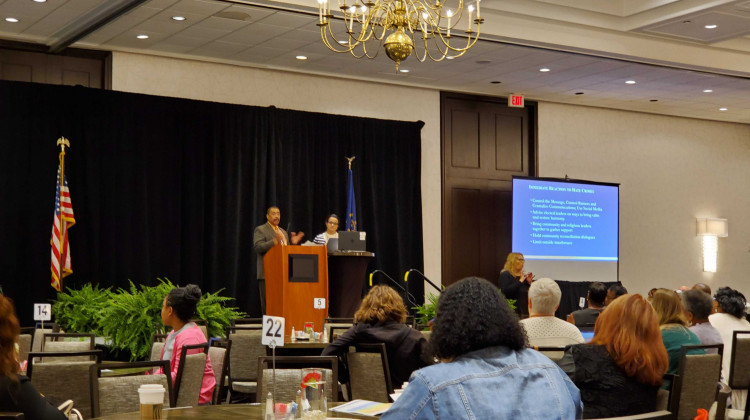 Department of Justice specialist Ken Bergeron and Women4Change Indiana executive director Rima Shahid address an Indiana Civil Rights Commission Conference. - Samantha Horton/IPB News